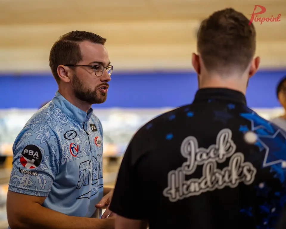 Chris Via talks with a bowler at our first clinic, 2024