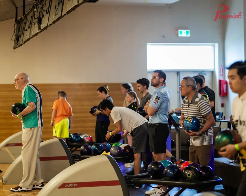 Bowlers on the lanes at Planet Bowl, 2024