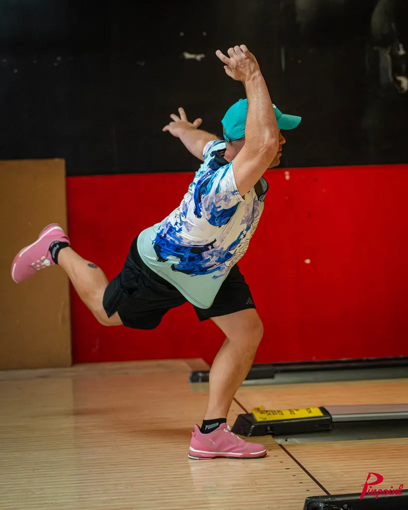 A bowler follows through on the lane at The Toronto Experience, 2025
